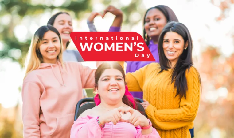 Text: International Women's Day. Image: 5 women making hearts with their hands. 